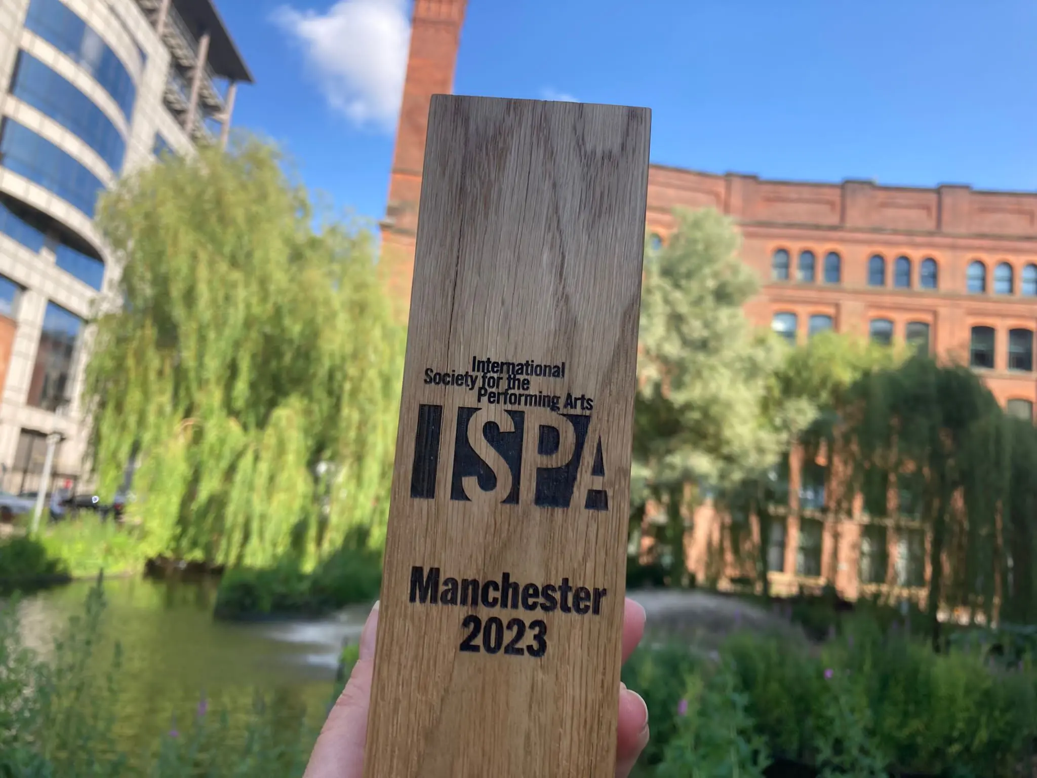 A wooden award with ISPA written on it