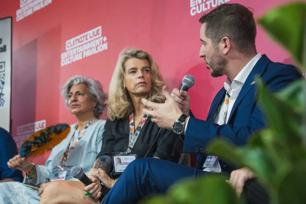 Speakers talking at our We Make Tomorrow activation event at COP30