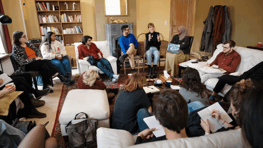 Participants gather in a circle for a discussion on one of our Creative Climate Leadership programmes.
