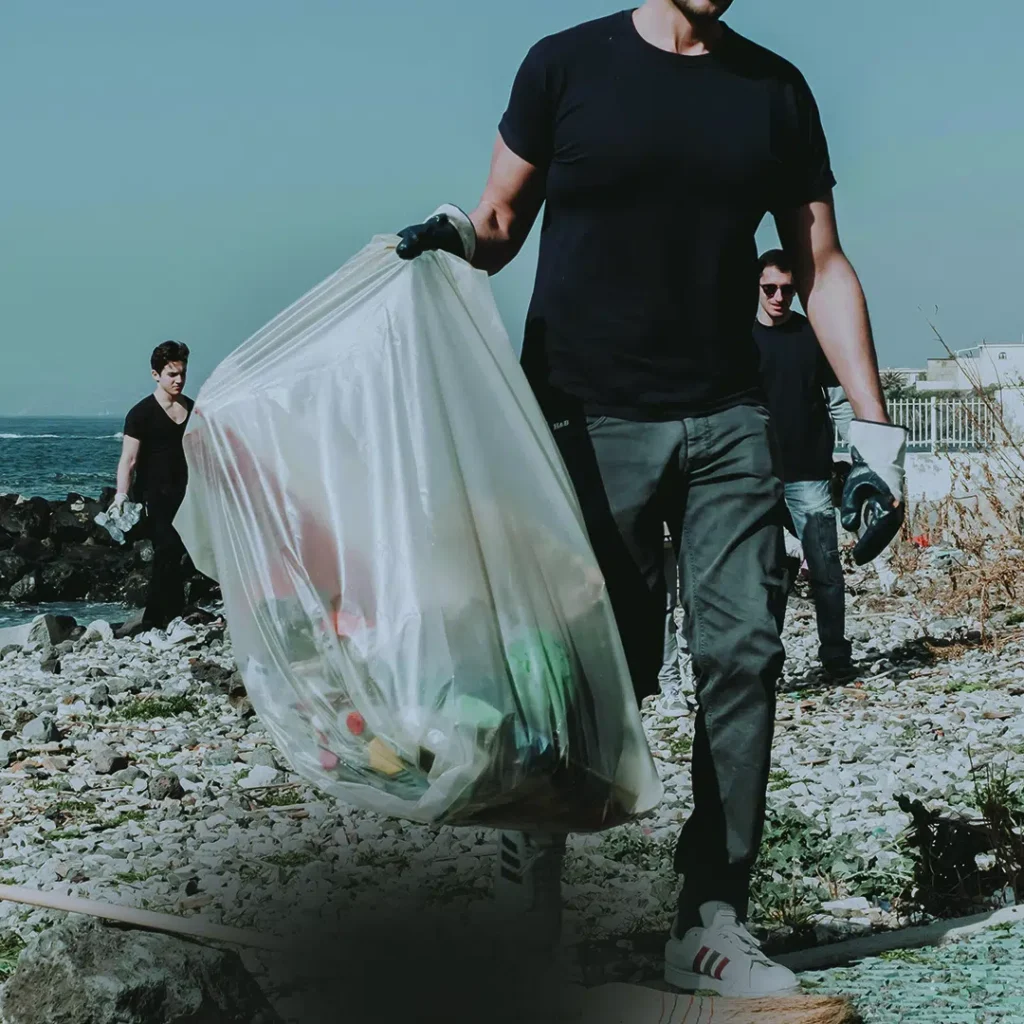 man carrying bins